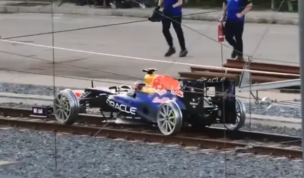VIDEO | Red Bull working on new promotional stunt, races F1 car over metro rails